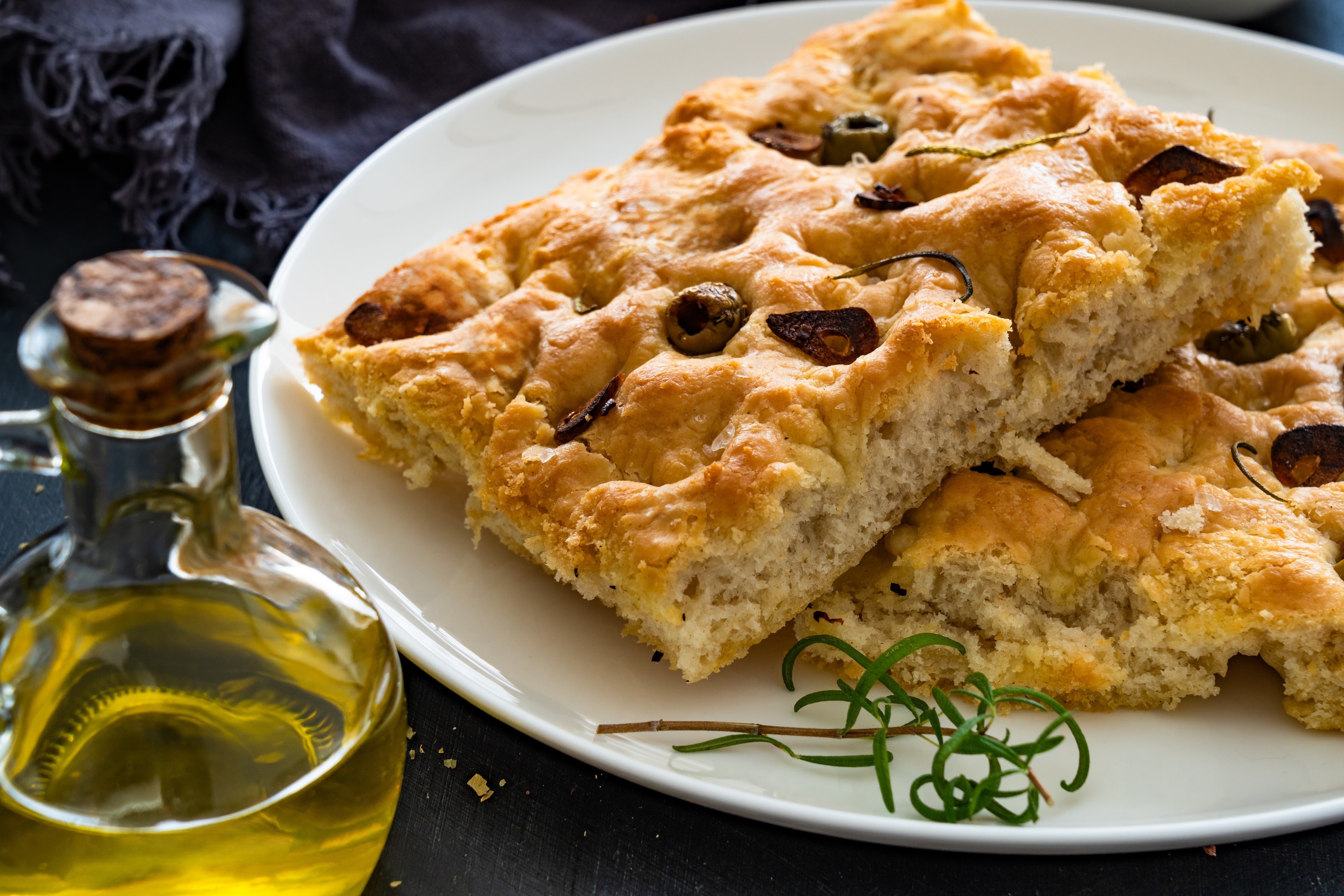 Fresh focaccia with olives and rosemary