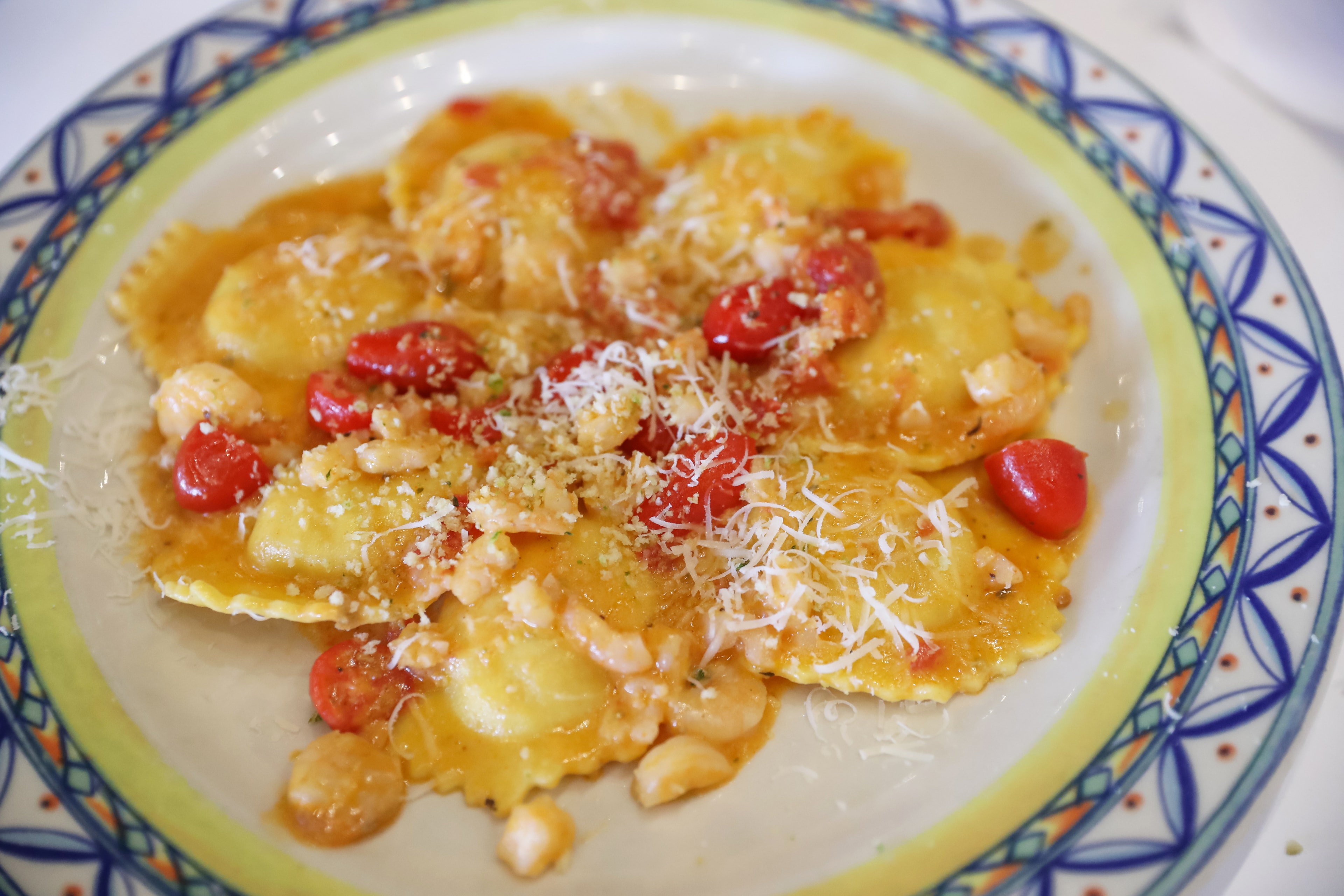 Handmade ravioli with tomatoes and parmesan